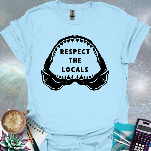 The silhouette of a menacing open shark jaw with sharp teeth, framing the text 'RESPECT THE LOCALS' in the center.