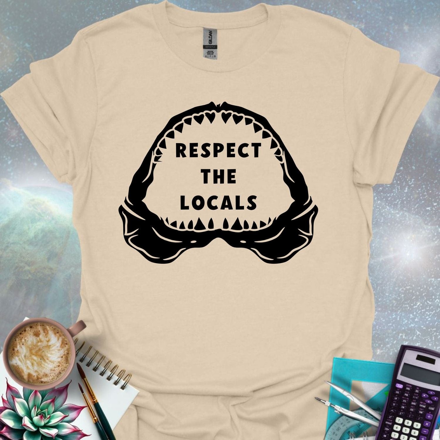 The silhouette of a menacing open shark jaw with sharp teeth, framing the text 'RESPECT THE LOCALS' in the center.