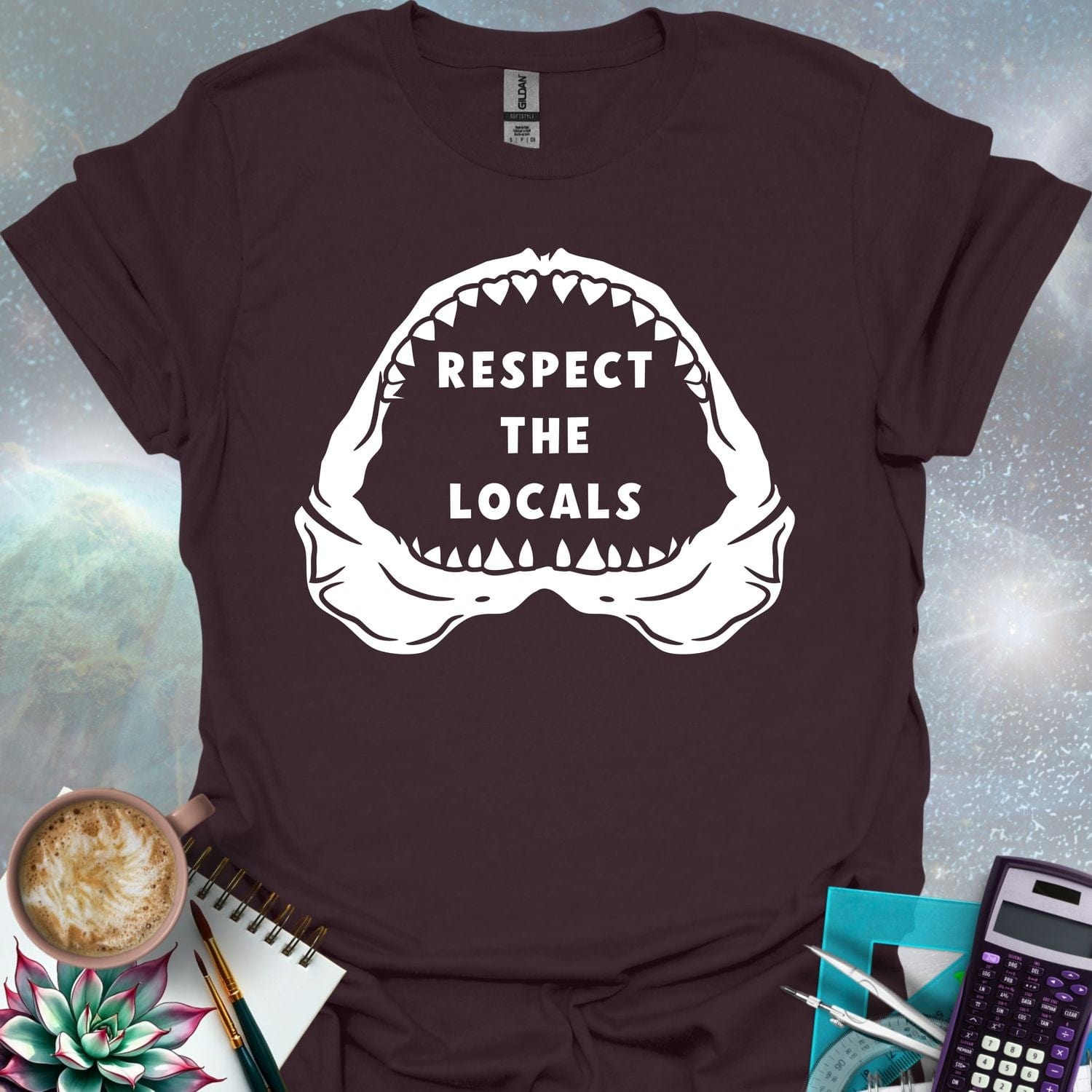 The silhouette of a menacing open shark jaw with sharp teeth, framing the text 'RESPECT THE LOCALS' in the center.