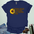 A funny biology t-shirt with a sunflower and the text 'Biology Really Grows On You,' a witty pun for biology teachers and plant lovers.