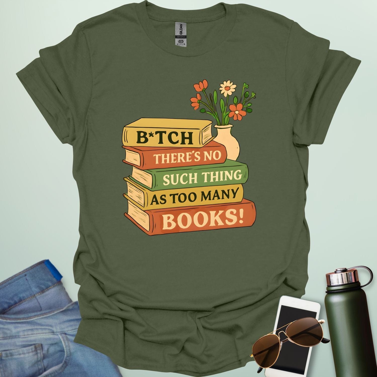 For readers with attitude — this bold “B*tch, There’s No Such Thing As Too Many Books” tee celebrates your love of literature with unapologetic wit.