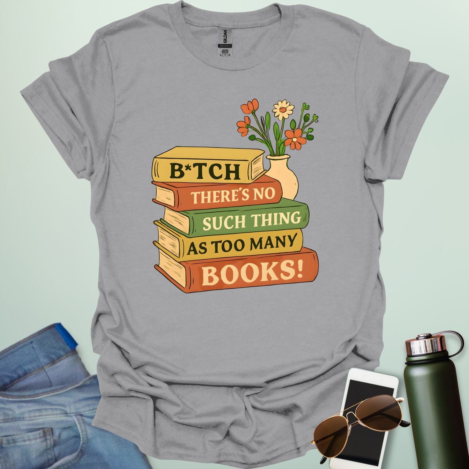 For readers with attitude — this bold “B*tch, There’s No Such Thing As Too Many Books” tee celebrates your love of literature with unapologetic wit.