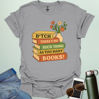 For readers with attitude — this bold “B*tch, There’s No Such Thing As Too Many Books” tee celebrates your love of literature with unapologetic wit.
