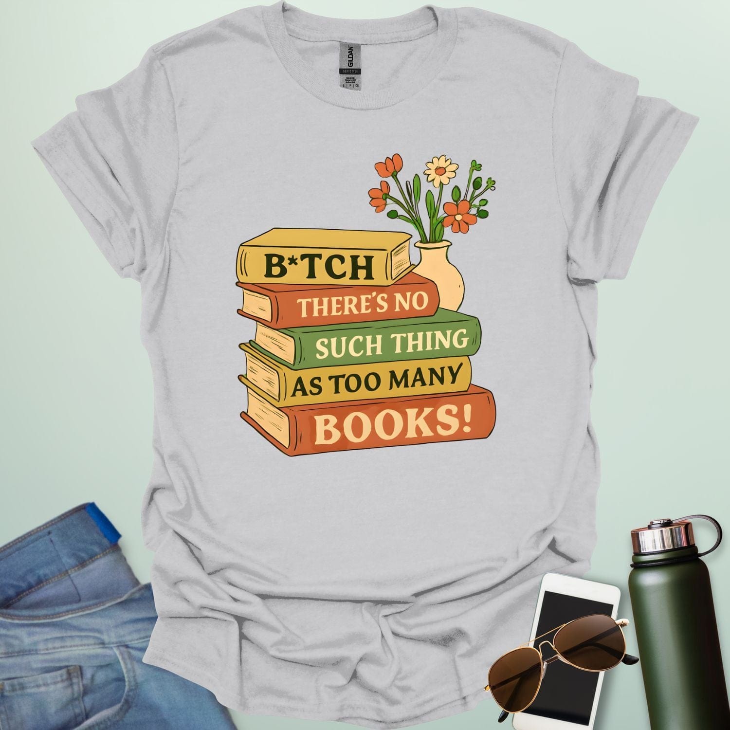 For readers with attitude — this bold “B*tch, There’s No Such Thing As Too Many Books” tee celebrates your love of literature with unapologetic wit.