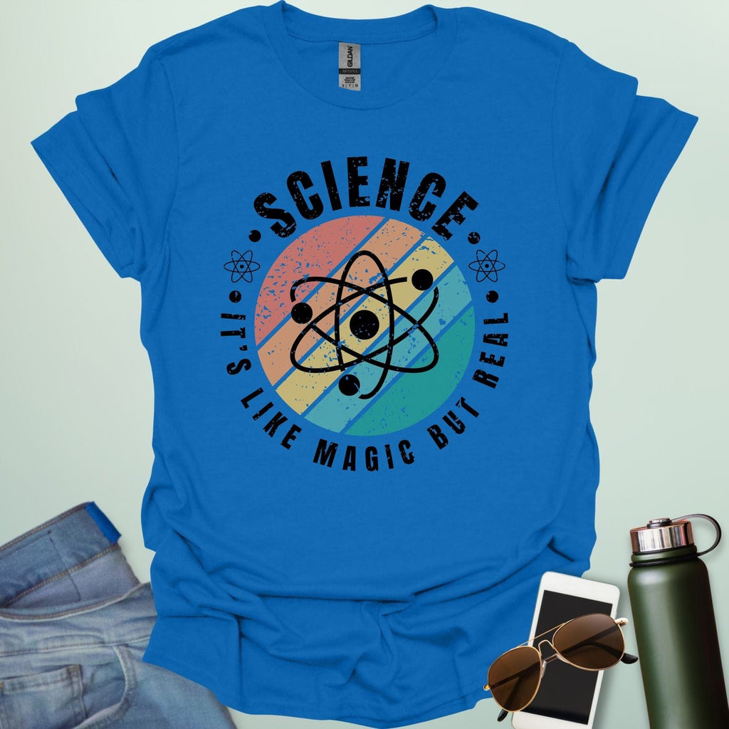 Science – It’s like magic but real’ t-shirt with atom graphic, clever science humor tee for science lovers, teachers, and STEM nerds.