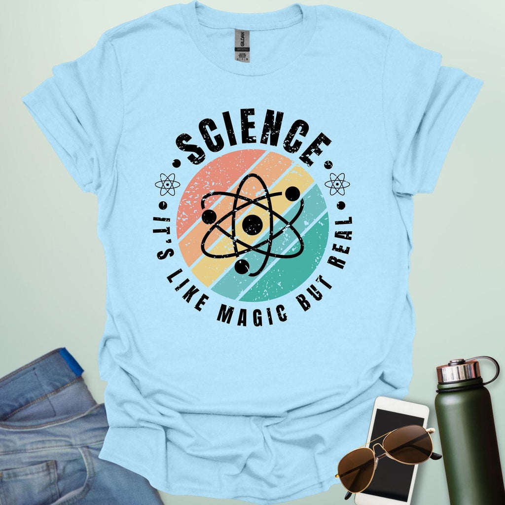 Science – It’s like magic but real’ t-shirt with atom graphic, clever science humor tee for science lovers, teachers, and STEM nerds.