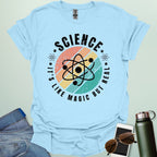 Science – It’s like magic but real’ t-shirt with atom graphic, clever science humor tee for science lovers, teachers, and STEM nerds.