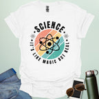 Science – It’s like magic but real’ t-shirt with atom graphic, clever science humor tee for science lovers, teachers, and STEM nerds.