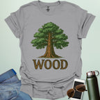 Wood tee with stylized tree / nature motif — perfect for fans of forests, national parks & Taylor Swift.