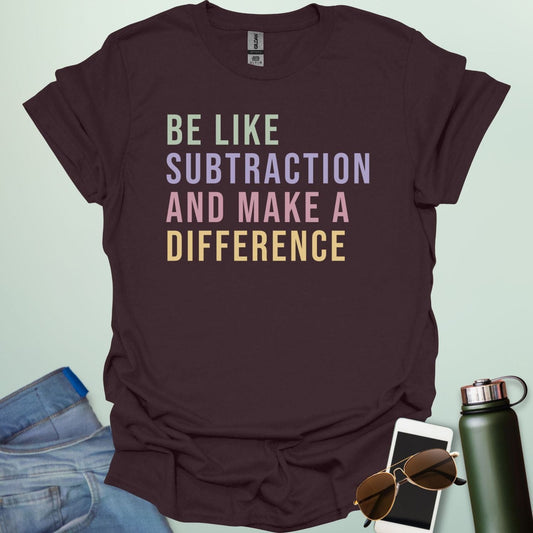 Colorful retro-style typography featuring the motivational math pun "BE LIKE SUBTRACTION AND MAKE A DIFFERENCE" in stacked green, purple, pink, and yellow text.