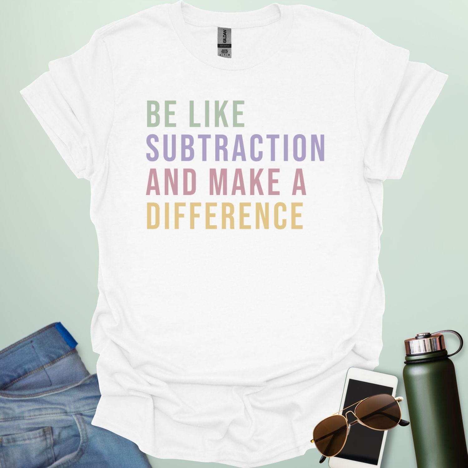 Colorful retro-style typography featuring the motivational math pun "BE LIKE SUBTRACTION AND MAKE A DIFFERENCE" in stacked green, purple, pink, and yellow text.