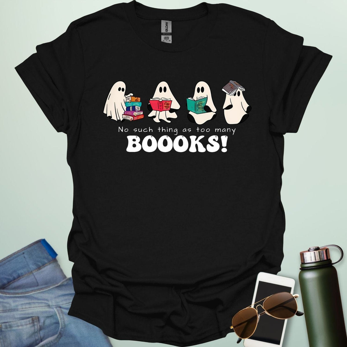 No Such Thing As Too Many Booooks t-shirt with ghostly lettering and book graphic — a spooky bookworm design for readers and teachers.