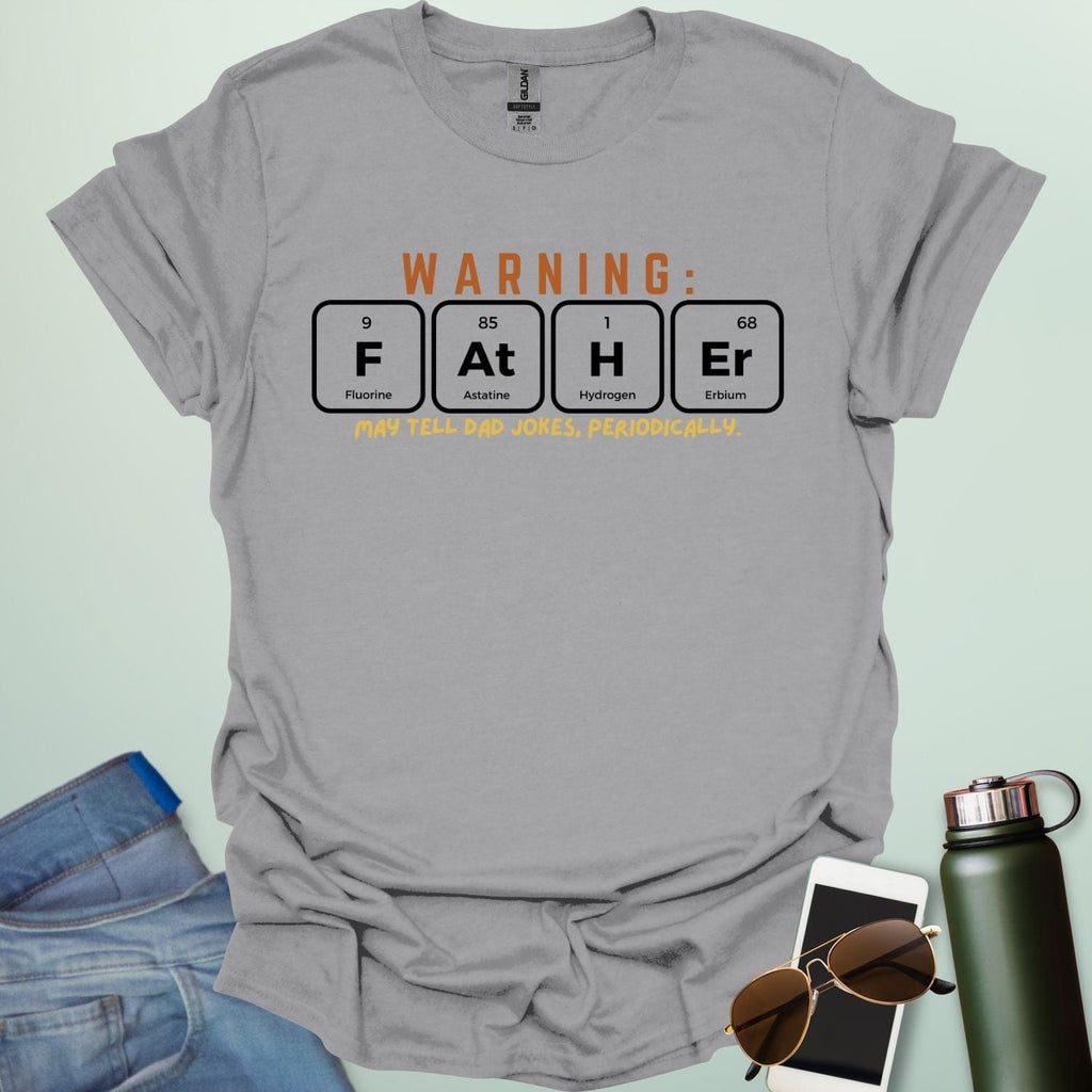 A funny periodic table t-shirt for fathers, using the elements Fluorine, Astatine, Hydrogen, and Erbium to spell 'FAtHEr'. The design says 'WARNING: FATHER MAY TELL DAD JOKES, PERIODICALLY.'
