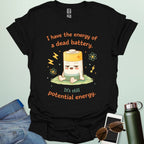 A cute cartoon graphic of a tired battery character sitting on a patch of grass with lightning bolts, atoms, and the text "I have the energy of a dead battery. It's still potential energy."