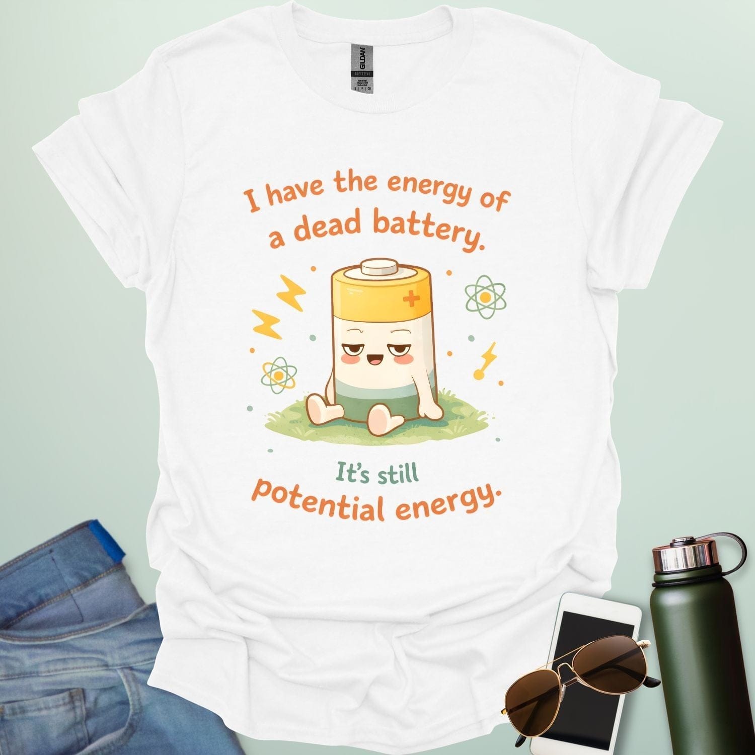 A cute cartoon graphic of a tired battery character sitting on a patch of grass with lightning bolts, atoms, and the text "I have the energy of a dead battery. It's still potential energy."