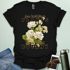 A charming t-shirt with a floral design and the text 'You Can't Grow Plants If You Haven't Botany,' a witty pun for botanists and gardeners.