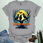 Ornithology Raven Halloween t-shirt featuring a raven perched with spooky Halloween elements — science & bird lover design.