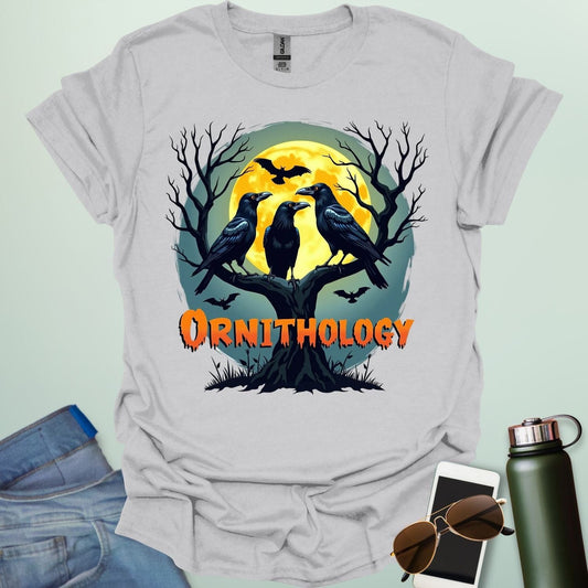 Ornithology Raven Halloween t-shirt featuring a raven perched with spooky Halloween elements — science & bird lover design.