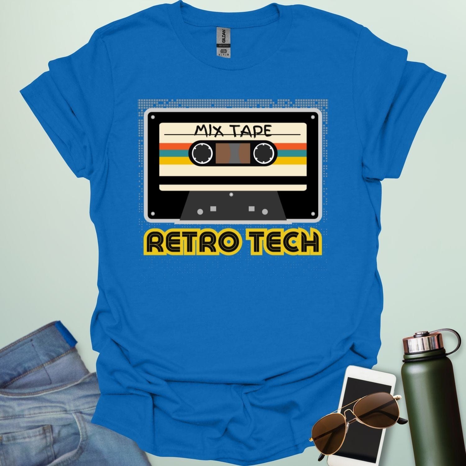Retro cassette mix-tape graphic on tech-nostalgia tee with geometric patterns and 80s/90s style.