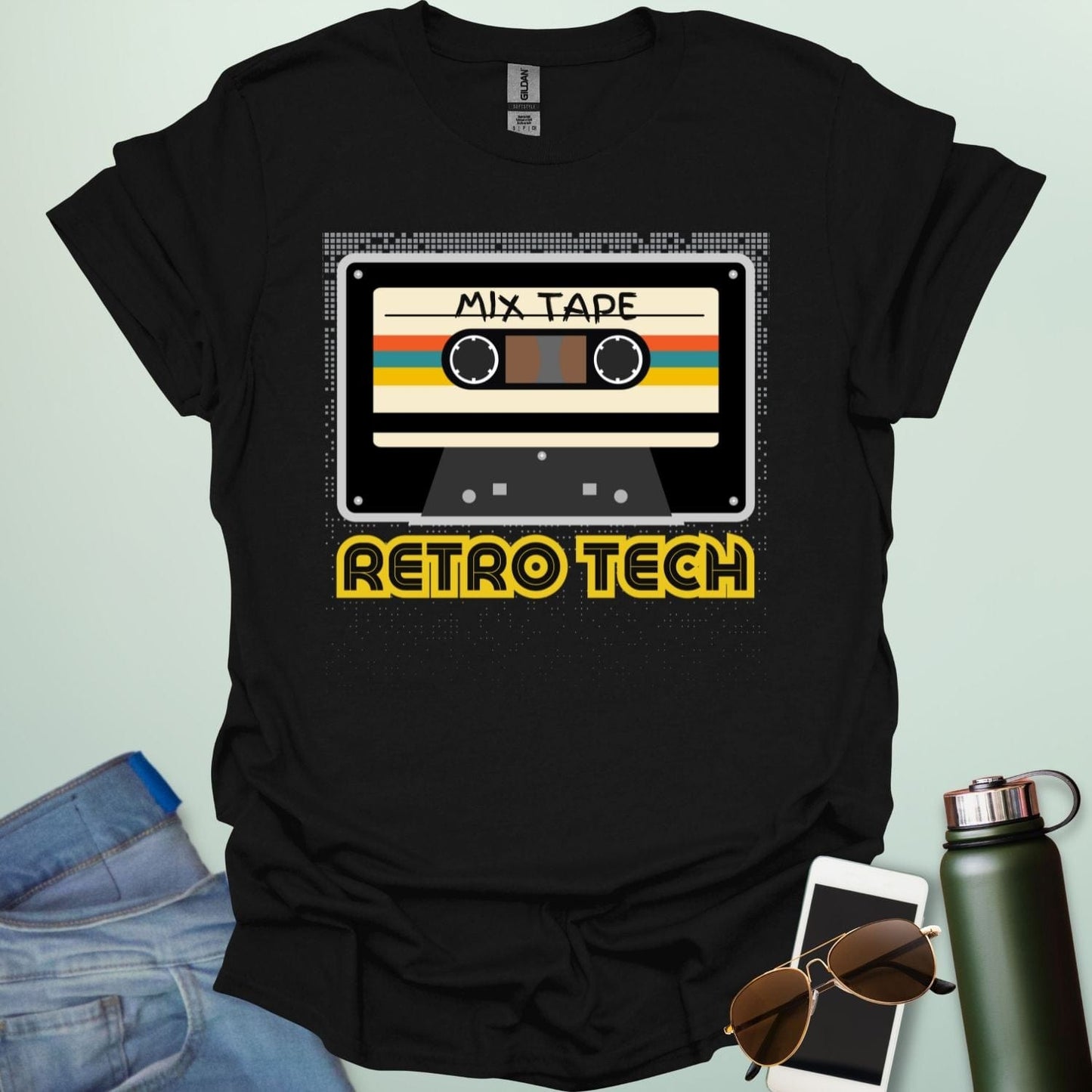 Retro cassette mix-tape graphic on tech-nostalgia tee with geometric patterns and 80s/90s style.