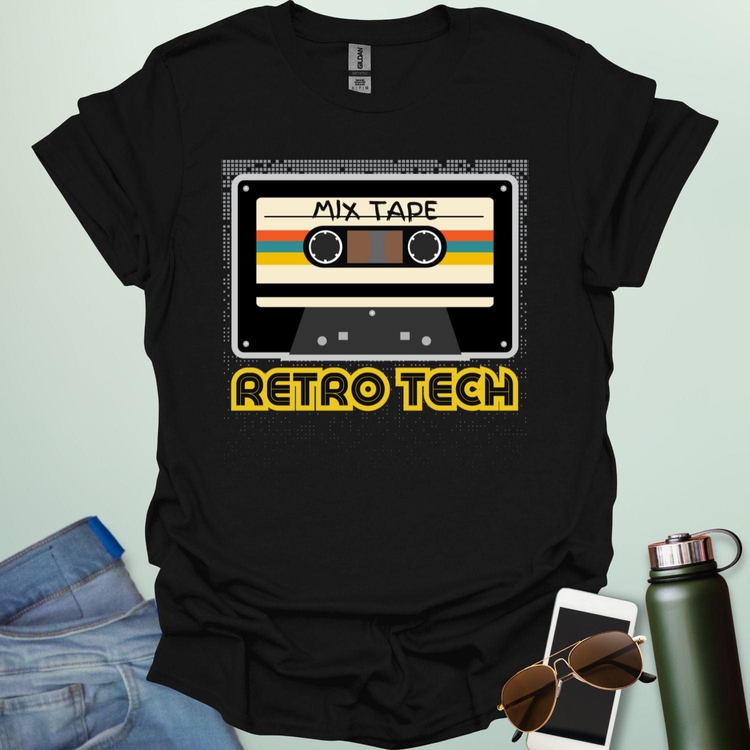 Retro cassette mix-tape graphic on tech-nostalgia tee with geometric patterns and 80s/90s style.