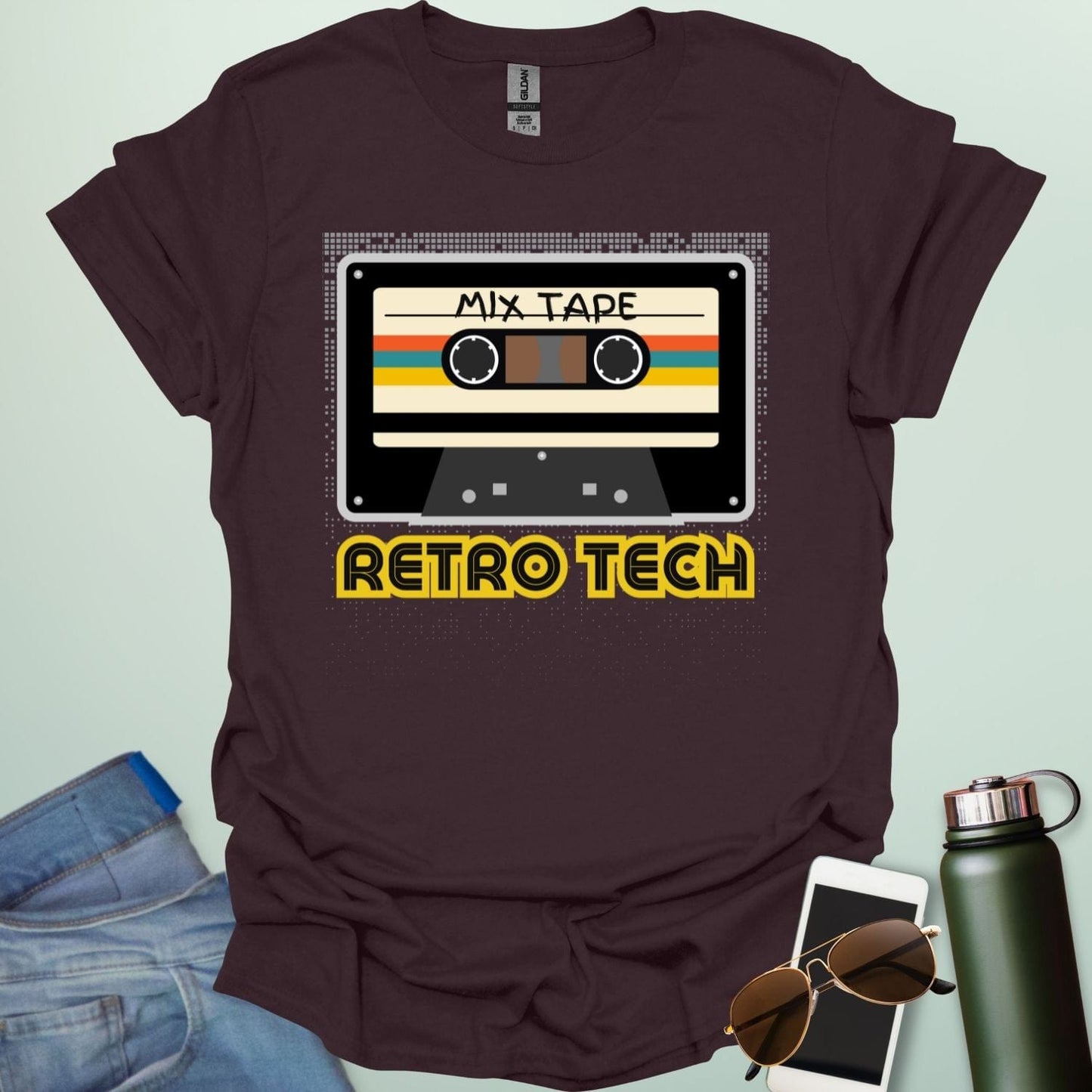Retro cassette mix-tape graphic on tech-nostalgia tee with geometric patterns and 80s/90s style.