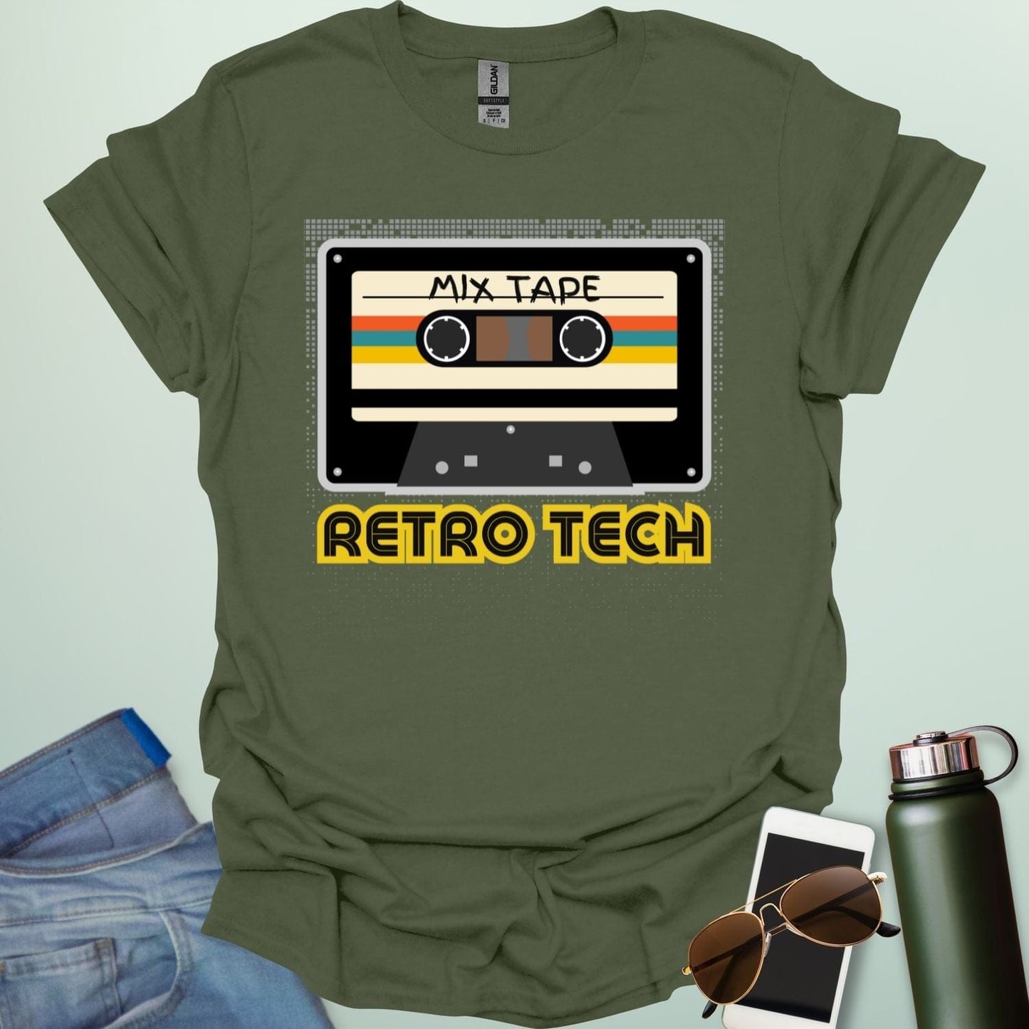 Retro cassette mix-tape graphic on tech-nostalgia tee with geometric patterns and 80s/90s style.