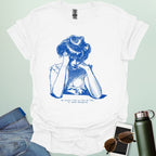 A white shirt with blue line art illustration of a woman looking frustrated with her head in her hands, above the text 'My social life is like my code:' and 'It needs debugging.