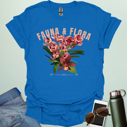 A beautiful t-shirt with a detailed illustration of a pink orchid and green leaves, perfect for gardeners and nature lovers.