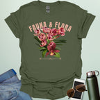 A beautiful t-shirt with a detailed illustration of a pink orchid and green leaves, perfect for gardeners and nature lovers.