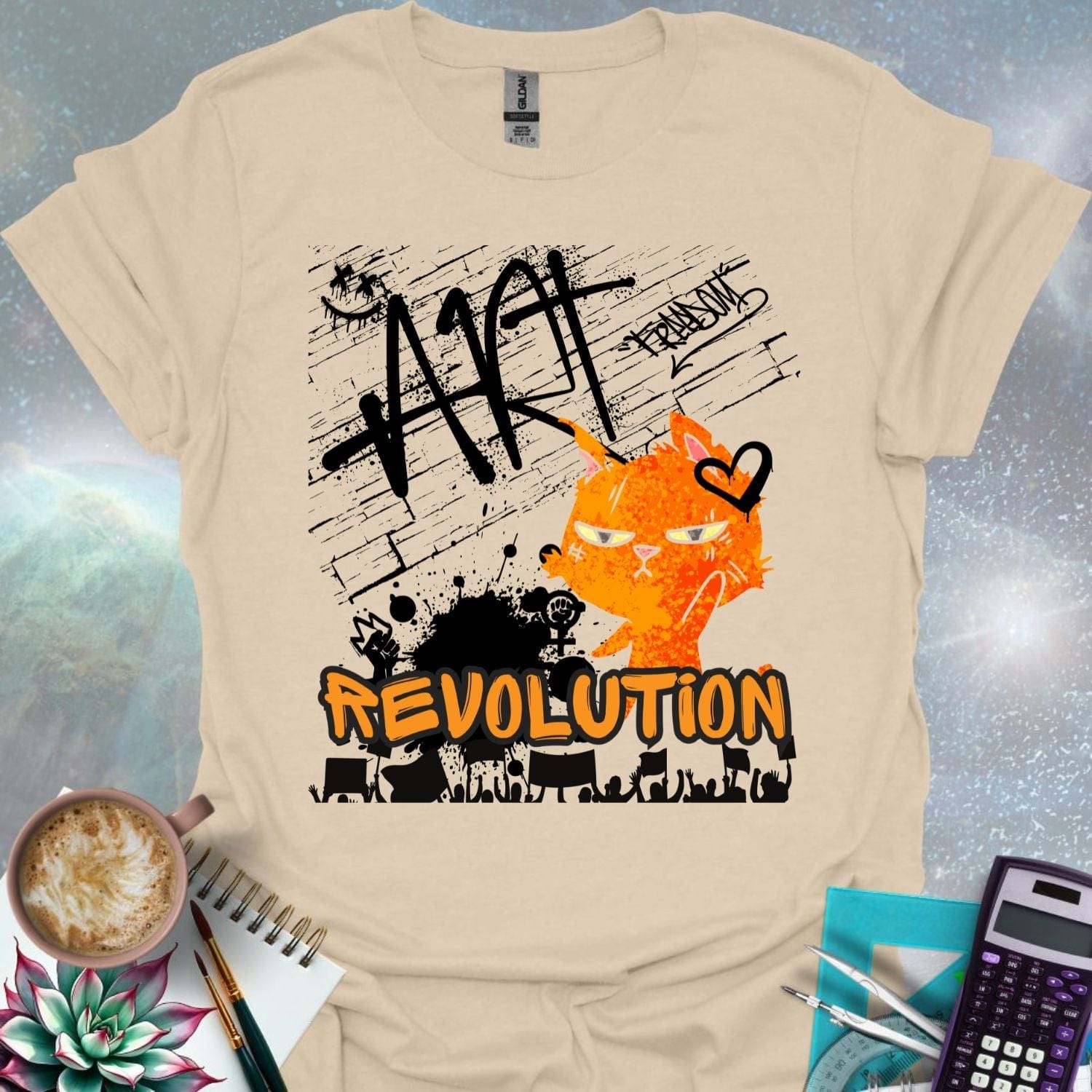 The word 'ART' in a bold, black graffiti style above an orange cartoon cat with a determined expression and a heart graphic. Below is the word 'REVOLUTION' in orange outlined in black, above a silhouette of a crowd holding signs.