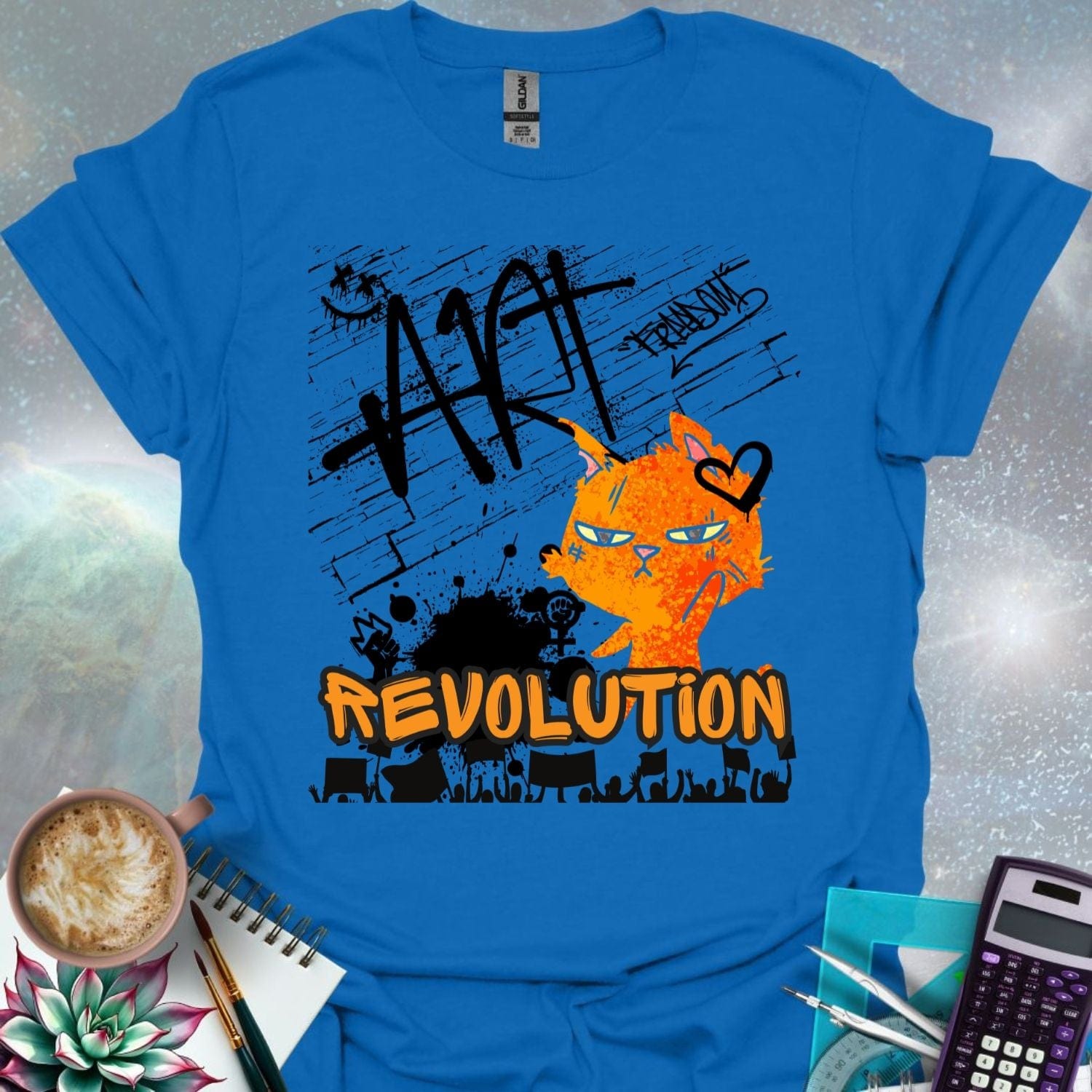 The word 'ART' in a bold, black graffiti style above an orange cartoon cat with a determined expression and a heart graphic. Below is the word 'REVOLUTION' in orange outlined in black, above a silhouette of a crowd holding signs.