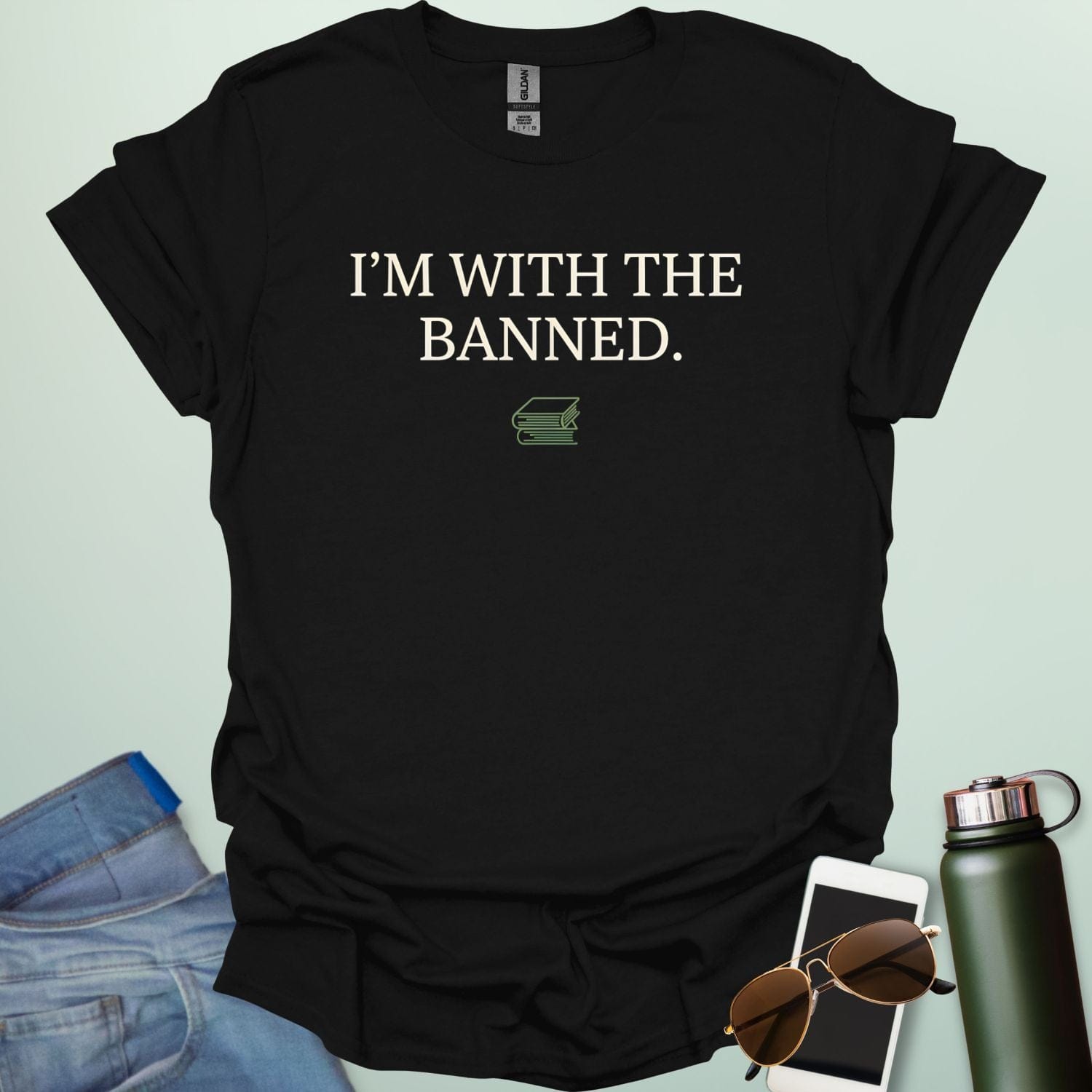 A minimalist graphic design featuring the bold serif text "I'M WITH THE BANNED." centered above a small line-art illustration of two stacked books.