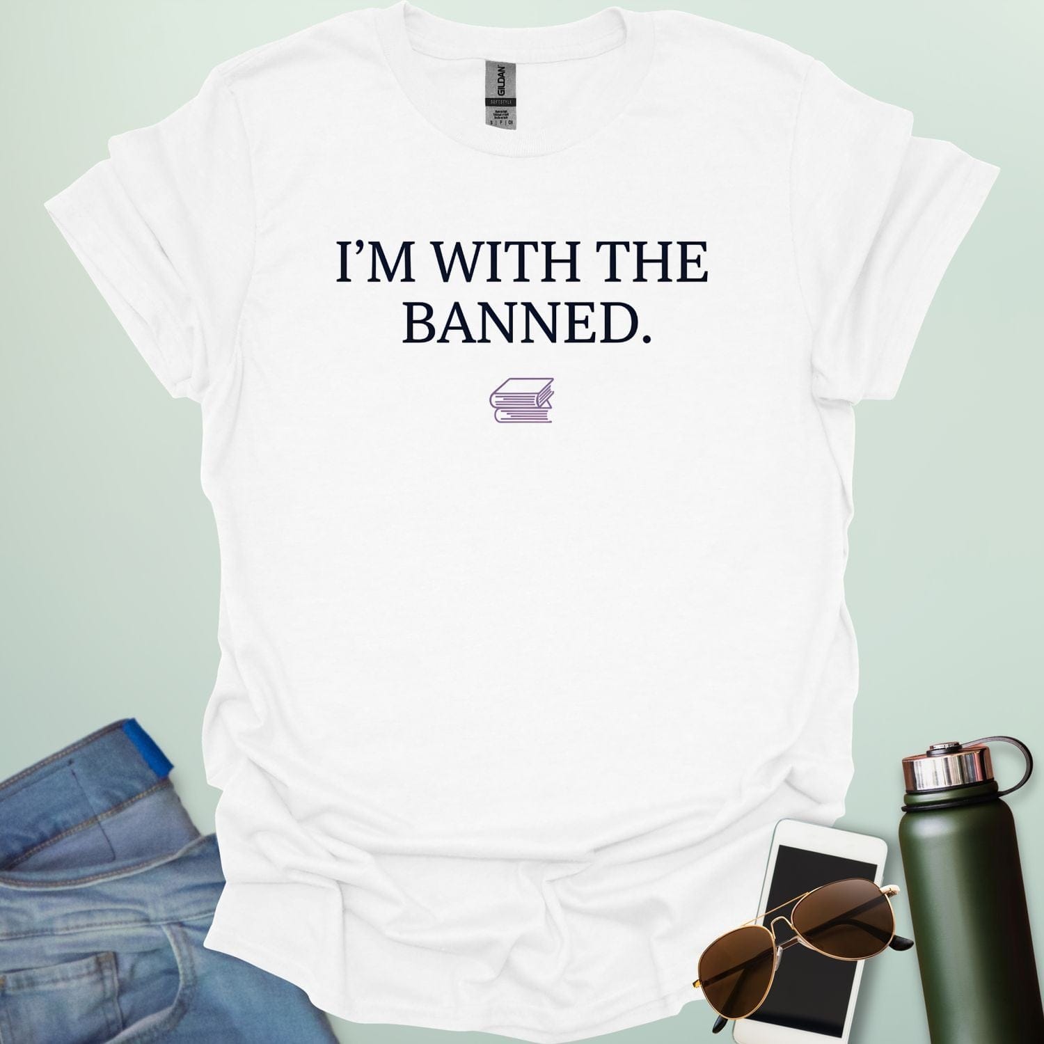 A minimalist graphic design featuring the bold serif text "I'M WITH THE BANNED." centered above a small line-art illustration of two stacked books.