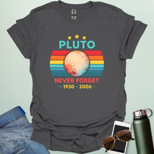 A retro-style graphic featuring the planet Pluto in front of a striped sunset background with the text "PLUTO NEVER FORGET — 1930 - 2006 —".