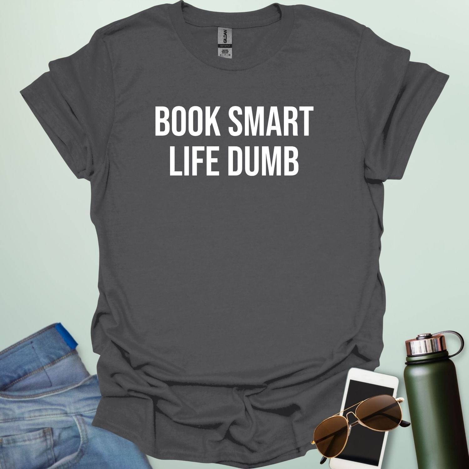 Minimalist typography design featuring the bold, all-caps text "BOOK SMART LIFE DUMB" centered in a clean sans-serif font.