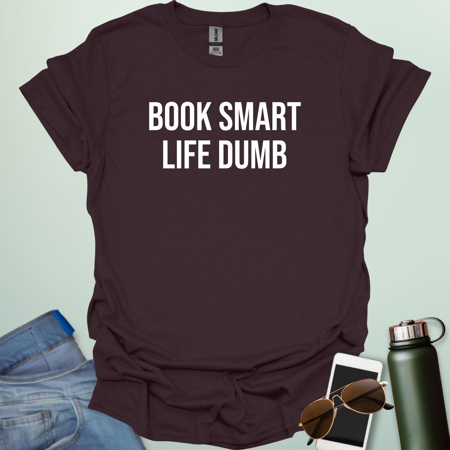 Minimalist typography design featuring the bold, all-caps text "BOOK SMART LIFE DUMB" centered in a clean sans-serif font.