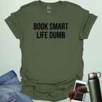 Minimalist typography design featuring the bold, all-caps text "BOOK SMART LIFE DUMB" centered in a clean sans-serif font.