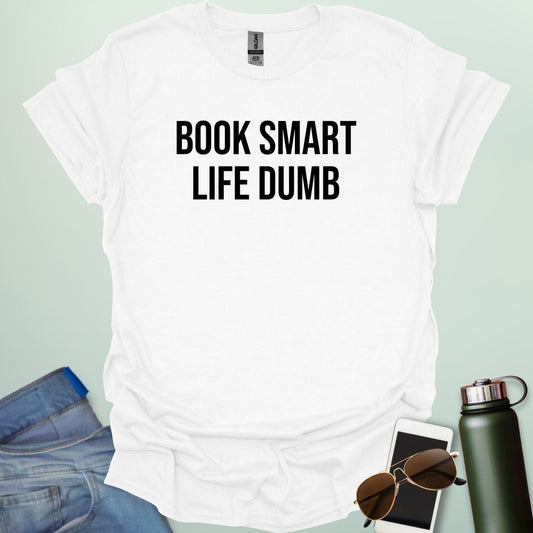 Minimalist typography design featuring the bold, all-caps text "BOOK SMART LIFE DUMB" centered in a clean sans-serif font.