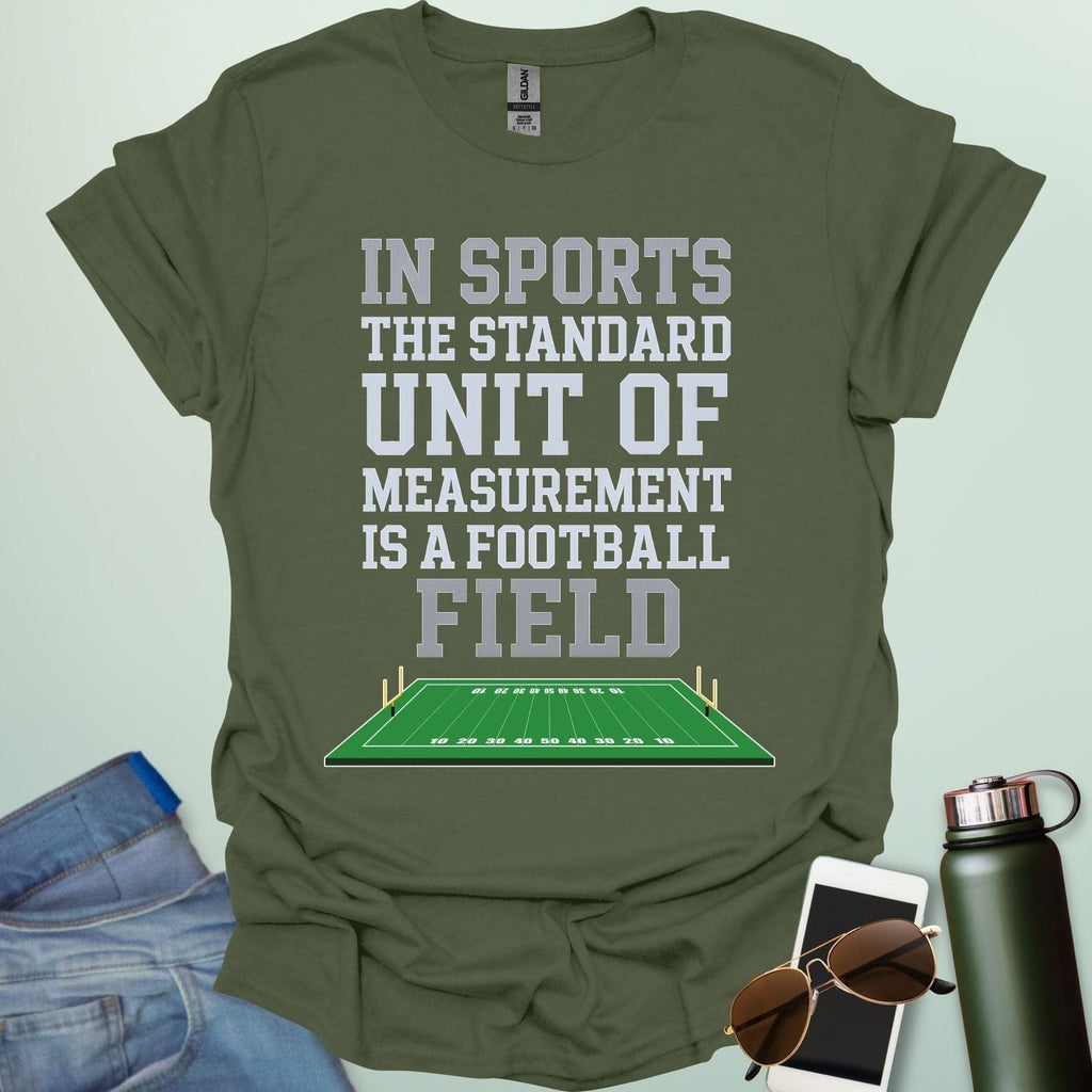 A military green t-shirt with the text 'IN SPORTS THE STANDARD UNIT OF MEASUREMENT IS A FOOTBALL FIELD' above an illustration of a football field.