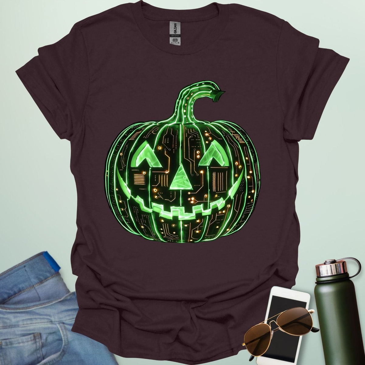 Pumpkin Tech t-shirt with glowing green jack-o-lantern circuit board design — Halloween STEM geek apparel.