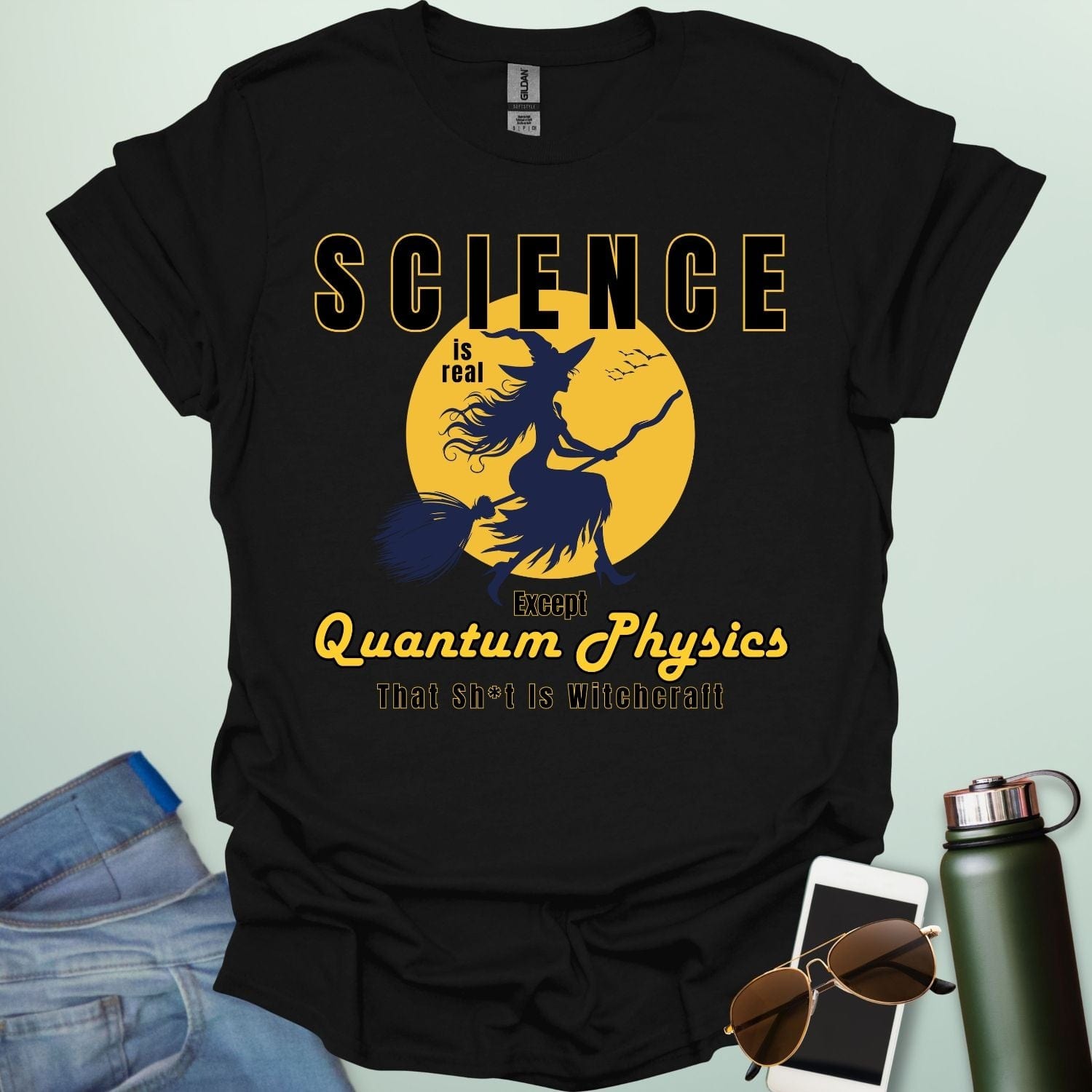 Quantum Physics Is Witchcraft t-shirt with bold typography — combining quantum physics and witchcraft themes for science & supernatural fans.