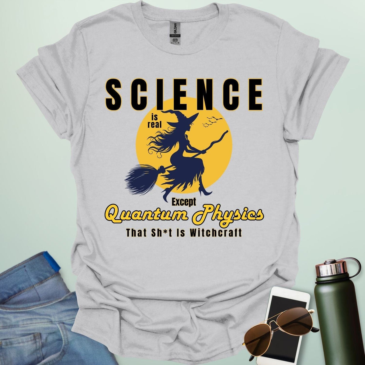 Quantum Physics Is Witchcraft t-shirt with bold typography — combining quantum physics and witchcraft themes for science & supernatural fans.