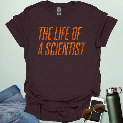 A dark chocolate t-shirt with the bold, distressed text 'THE LIFE OF A SCIENTIST.'