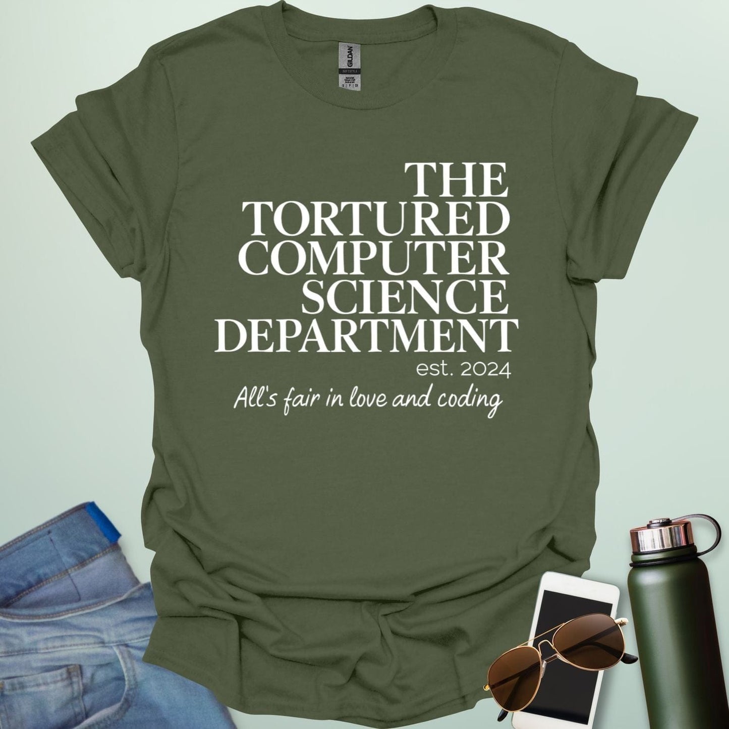 A military green t-shirt with the text 'THE TORTURED COMPUTER SCIENCE DEPARTMENT est. 2024' and 'All's fair in love and coding.'