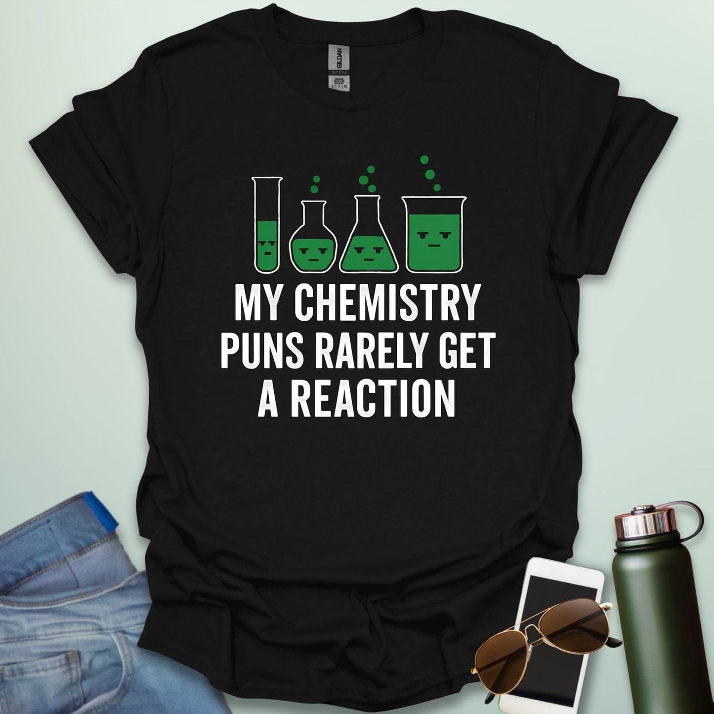 "My Chemistry Puns Rarely Get a Reaction' t-shirt with a humorous science pun design.