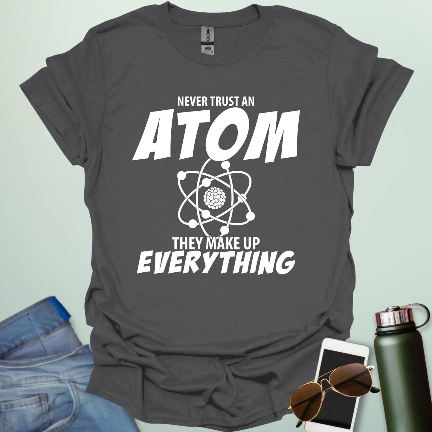 'Never Trust an Atom, They Make Up Everything' funny science t-shirt with atom graphic.