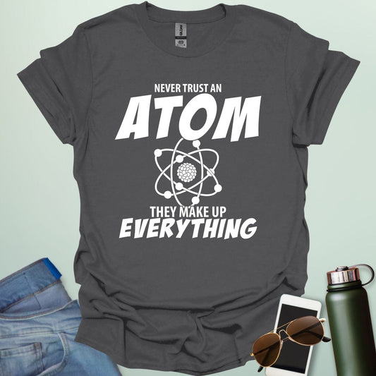 'Never Trust an Atom, They Make Up Everything' funny science t-shirt with atom graphic.