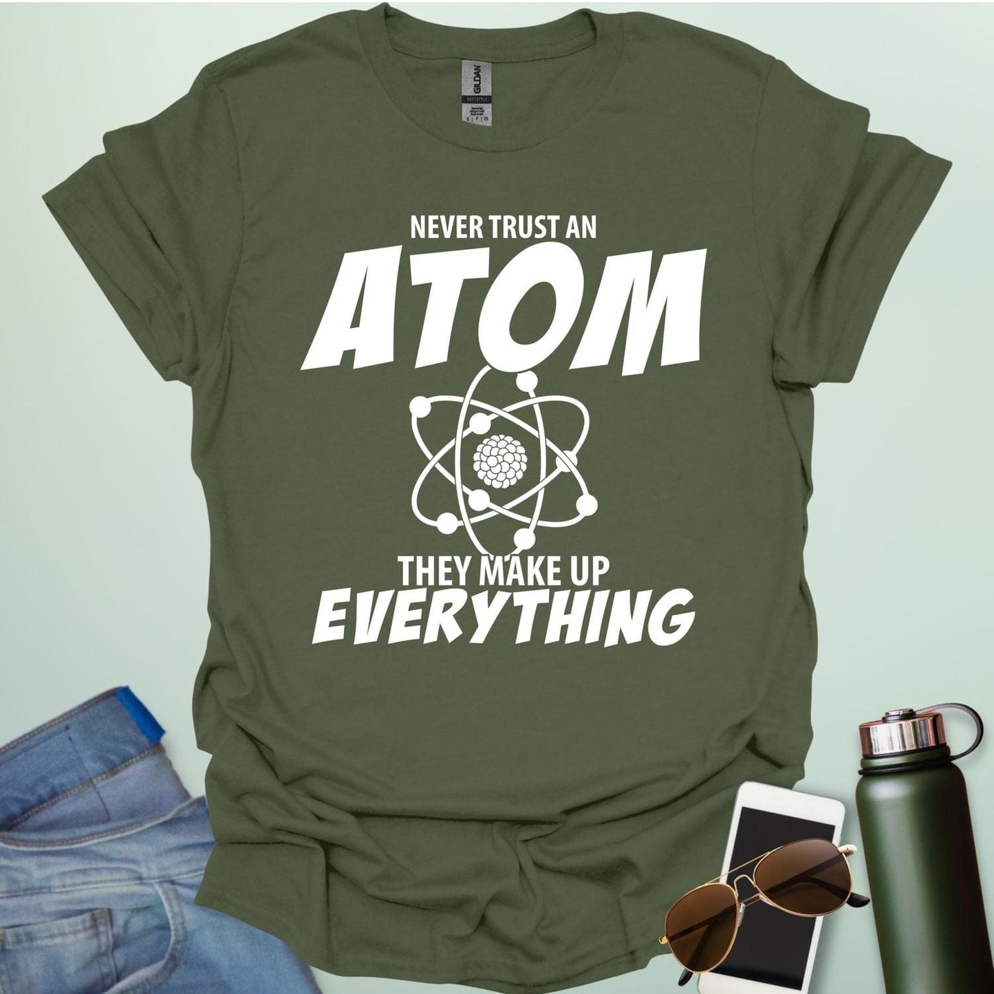 'Never Trust an Atom, They Make Up Everything' funny science t-shirt with atom graphic.