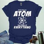 'Never Trust an Atom, They Make Up Everything' funny science t-shirt with atom graphic.